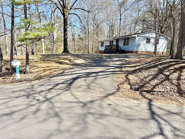 exterior space with aphalt driveway