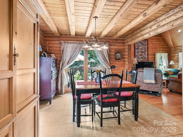 dining space featuring beamed ceiling, light tile patterned flooring, wood ceiling, and a notable chandelier