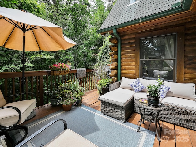 wooden deck featuring an outdoor hangout area