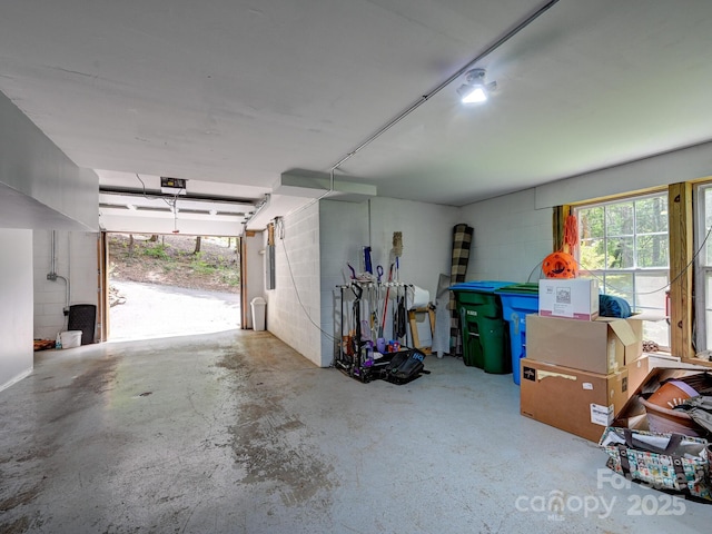 garage with concrete block wall