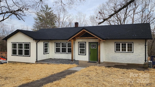621 Watts St NE, Valdese, NC 28690 - single story home featuring brick siding, roof with shingles, and a chimney
