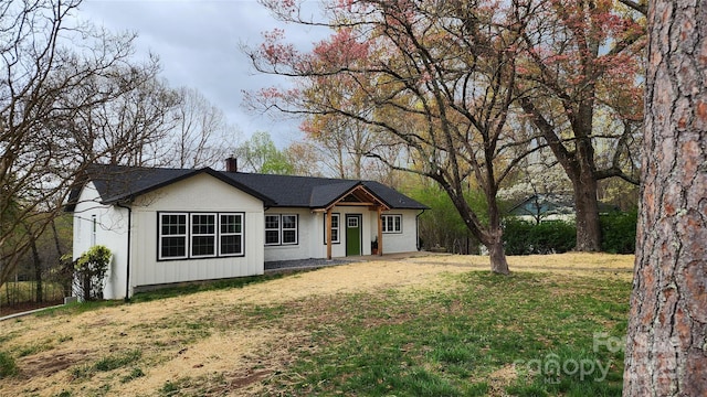 621 Watts St NE, Valdese, NC 28690 - ranch-style home with a chimney and a front lawn