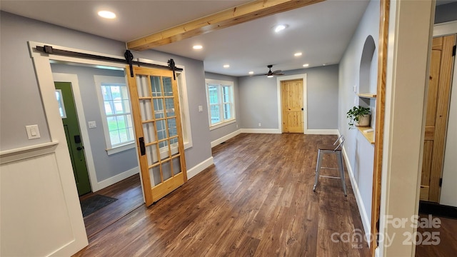 621 Watts St NE, Valdese, NC 28690 - interior space with beamed ceiling, recessed lighting, a barn door, ceiling fan, and dark wood-type flooring