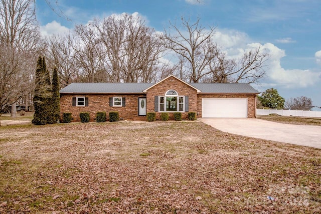 ranch-style house with brick siding, driveway, an attached garage, and fence