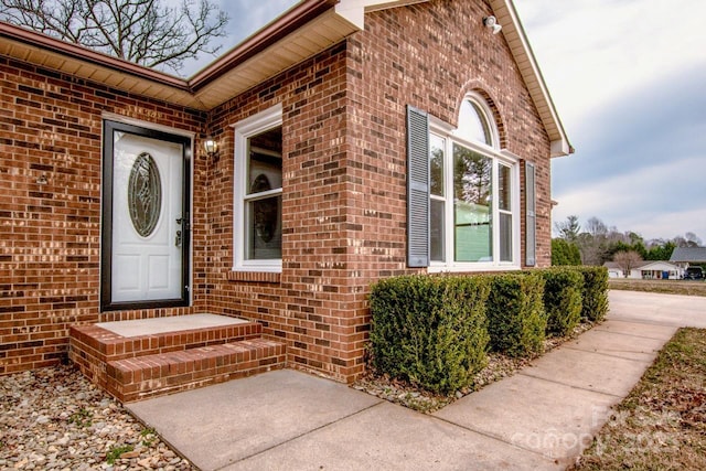 entrance to property with brick siding