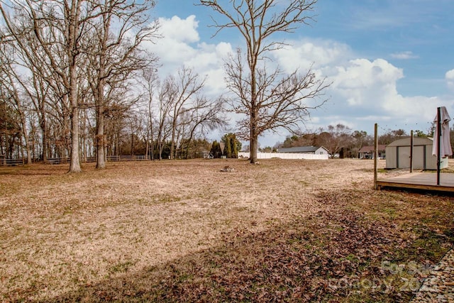 view of yard featuring a shed and an outbuilding