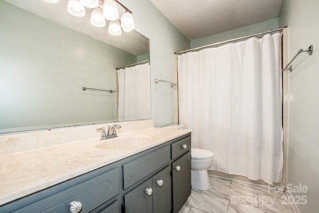 full bath featuring marble finish floor, vanity, and toilet