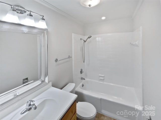 full bathroom featuring crown molding, bathing tub / shower combination, toilet, and vanity