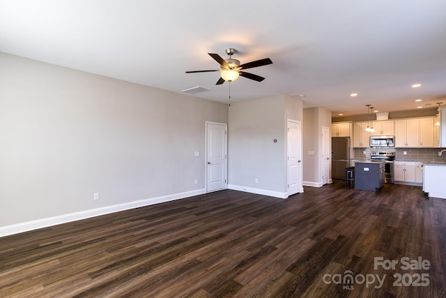 unfurnished living room with dark wood-style floors, recessed lighting, visible vents, a ceiling fan, and baseboards