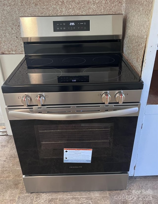 room details featuring stainless steel electric stove