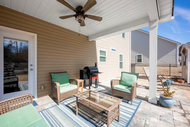 view of patio featuring ceiling fan, fence, an outdoor hangout area, and area for grilling