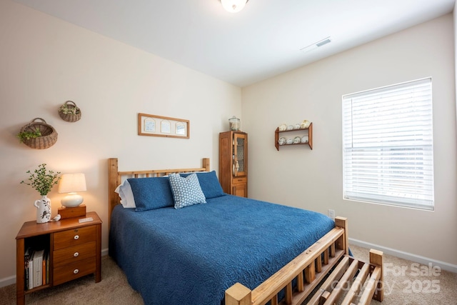 bedroom featuring carpet, visible vents, and baseboards