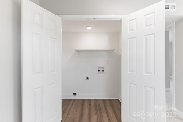 laundry area with laundry area, baseboards, visible vents, hookup for a washing machine, and electric dryer hookup