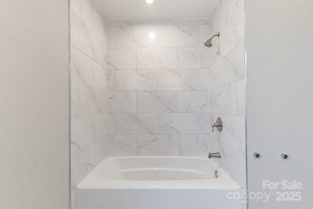 bathroom with shower / bathing tub combination