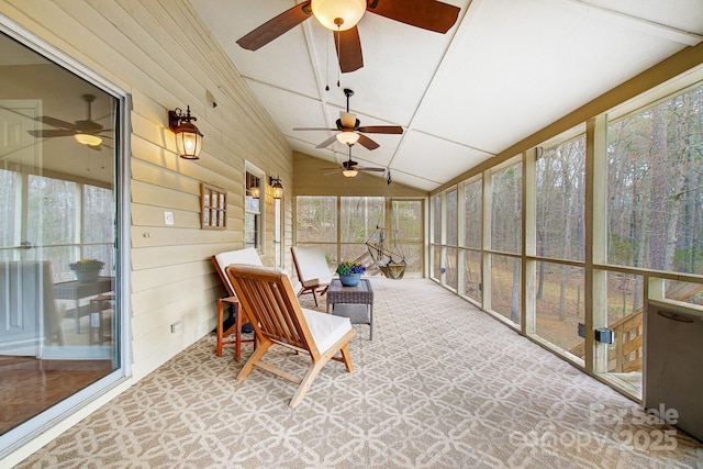 sunroom featuring a wealth of natural light and lofted ceiling