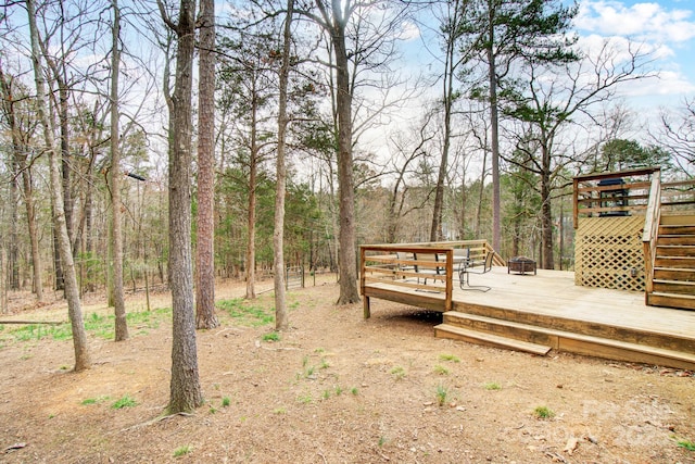 view of yard with a wooden deck