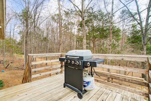 wooden terrace with area for grilling