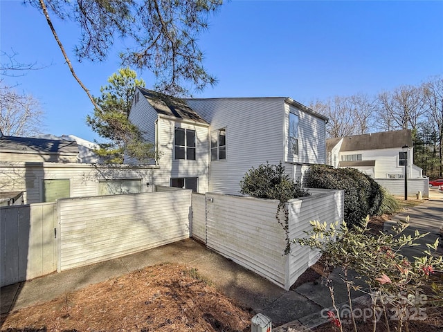 view of side of property with fence