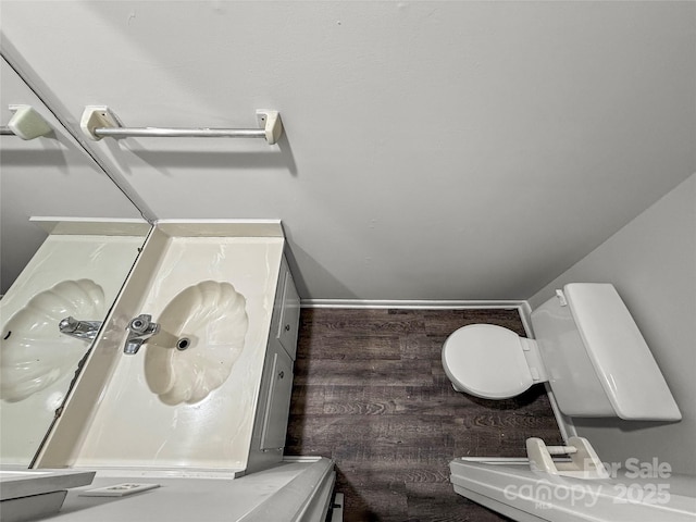 bathroom featuring toilet and vanity