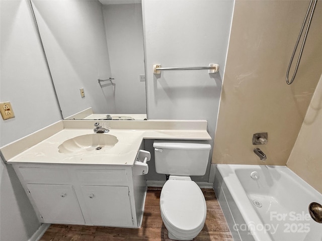 full bathroom with vanity, tub / shower combination, wood finished floors, and toilet