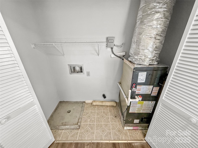 laundry room featuring washer hookup, laundry area, hookup for an electric dryer, and wood finished floors