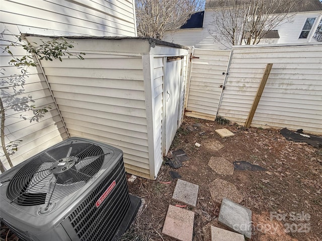 exterior space featuring fence and central AC