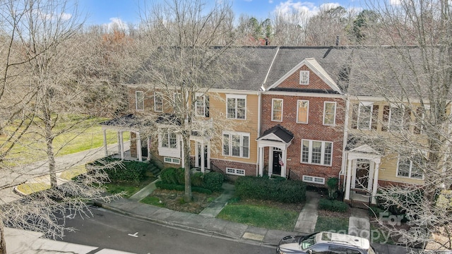 view of front of home featuring brick siding