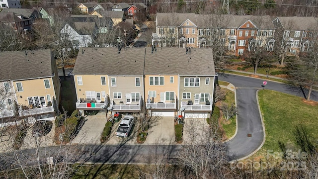 birds eye view of property with a residential view