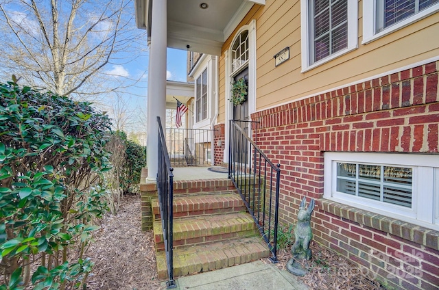 property entrance with brick siding