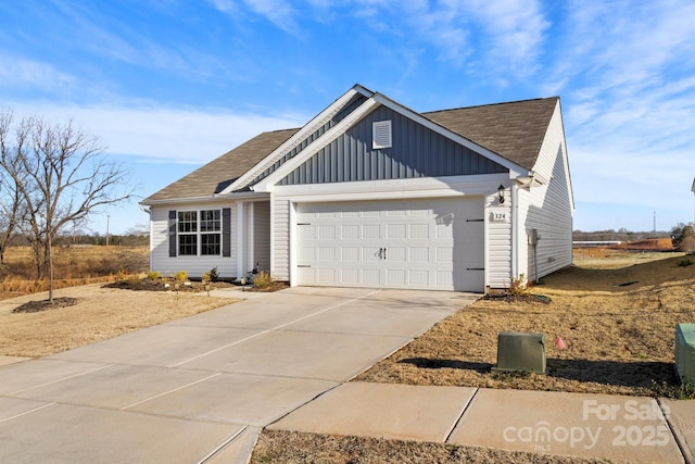 view of front facade with a garage, concrete driveway, roof with shingles, and board and batten siding