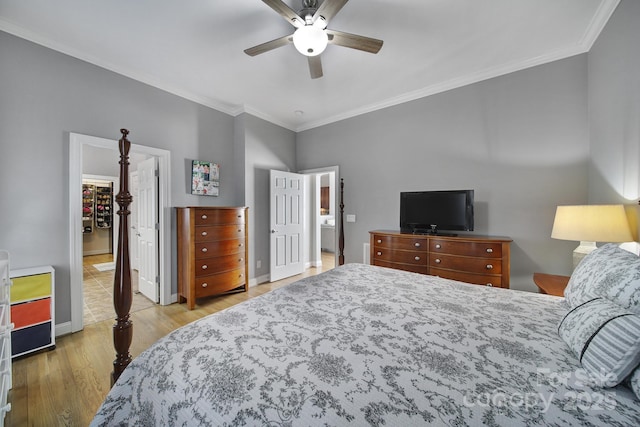 bedroom featuring ceiling fan, crown molding, baseboards, and wood finished floors