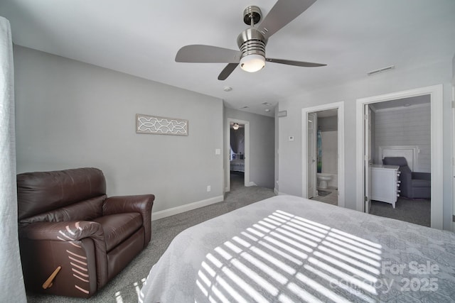 carpeted bedroom with ensuite bathroom, a ceiling fan, visible vents, baseboards, and a spacious closet