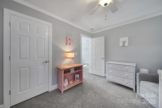 carpeted bedroom with baseboards, ornamental molding, and ceiling fan