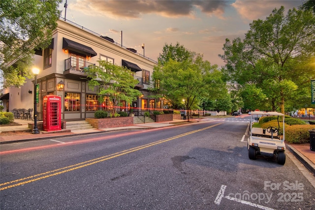 view of road with curbs and sidewalks