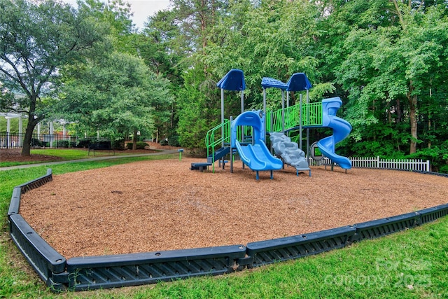 community jungle gym featuring fence