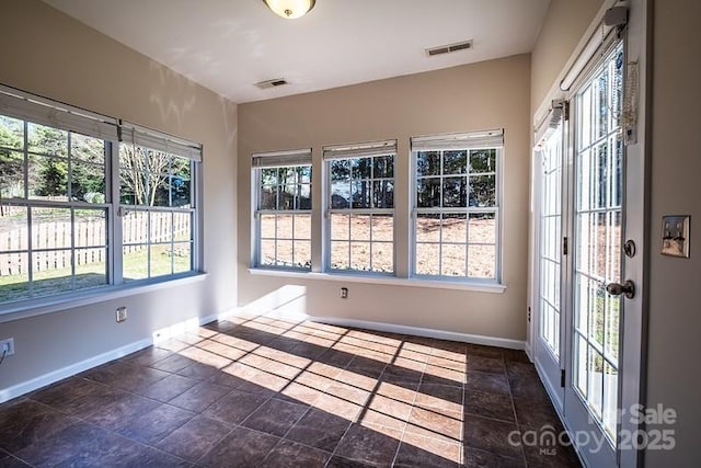 unfurnished sunroom with visible vents