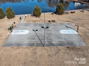 view of storm shelter featuring a water view