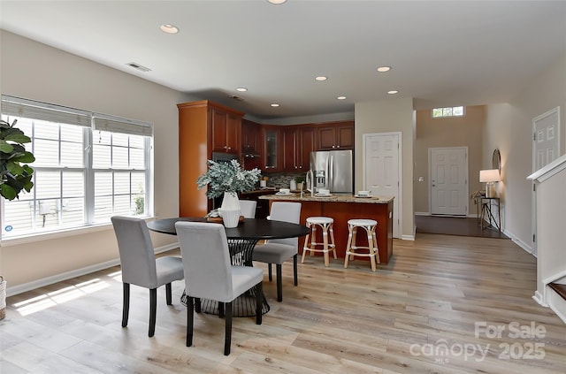 2017 Bridleside Dr, Indian Trail, NC 28079 - dining room featuring healthy amount of natural light, recessed lighting, light wood-type flooring, and baseboards