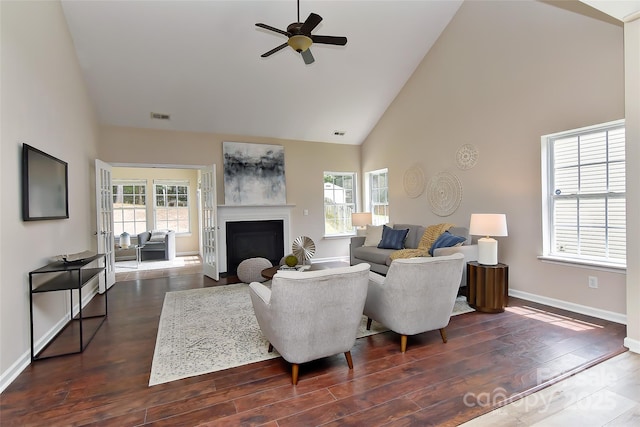 2017 Bridleside Dr, Indian Trail, NC 28079 - living area with high vaulted ceiling, a ceiling fan, plenty of natural light, baseboards, and dark wood-style flooring