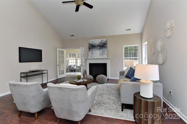 2017 Bridleside Dr, Indian Trail, NC 28079 - living room with ceiling fan, baseboards, a fireplace with flush hearth, high vaulted ceiling, and dark wood-type flooring