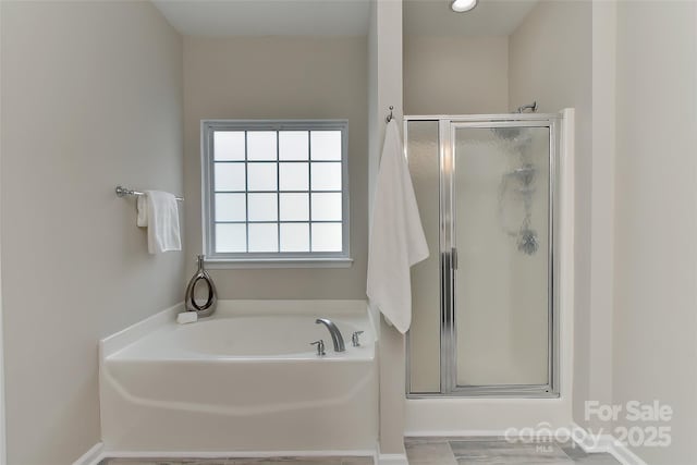 2017 Bridleside Dr, Indian Trail, NC 28079 - bathroom featuring a shower stall and a garden tub