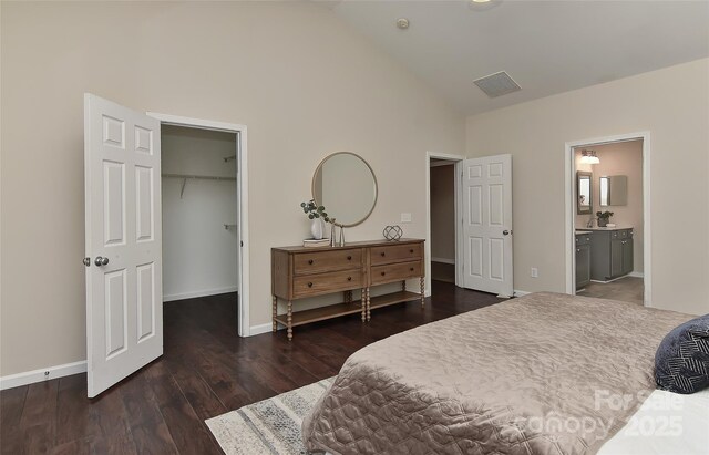 2017 Bridleside Dr, Indian Trail, NC 28079 - bedroom with high vaulted ceiling, a spacious closet, wood finished floors, baseboards, and connected bathroom