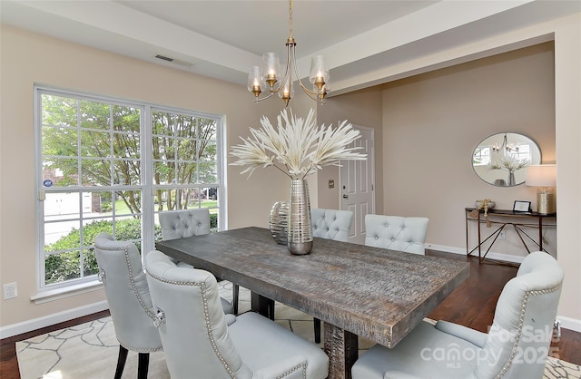 2017 Bridleside Dr, Indian Trail, NC 28079 - dining space with a chandelier, baseboards, wood finished floors, and plenty of natural light