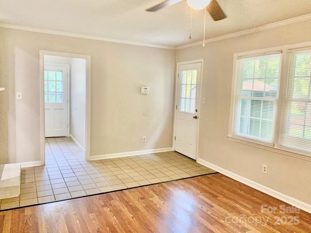 doorway featuring plenty of natural light, light wood-type flooring, and crown molding