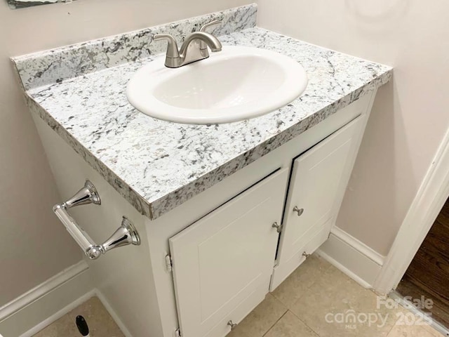 details with baseboards and vanity