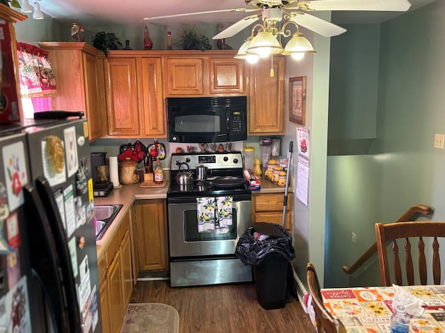 kitchen with dark wood-style flooring, brown cabinets, light countertops, a ceiling fan, and black appliances