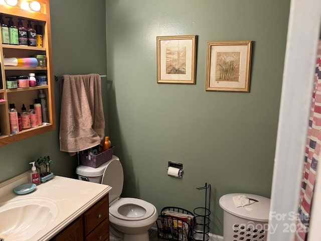 full bathroom featuring vanity and toilet