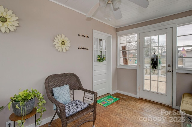 sunroom featuring plenty of natural light and ceiling fan