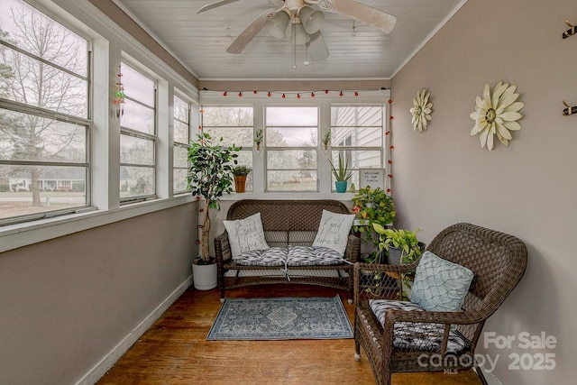 sunroom / solarium with ceiling fan