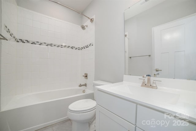 full bath with visible vents, toilet, vanity, shower / tub combination, and tile patterned floors